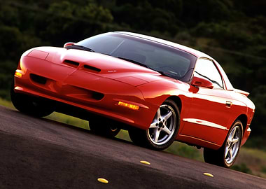 Red Pontiac Firebird on Road