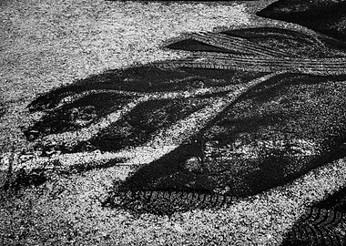 Black and White Tire Tracks on Asphalt