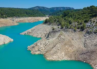 Turquoise Lake Surrounded by Rocky Shoreline