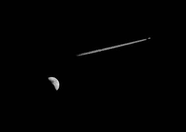 Moon, Plane, and Contrail in Darkness