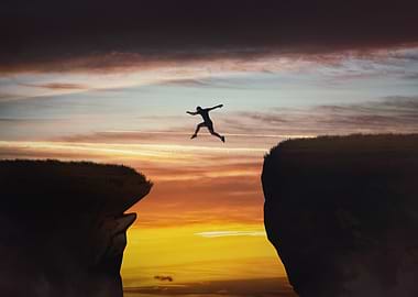 Silhouette Jumper Cliff Sunset