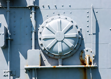 Metal hatch on a gray wall