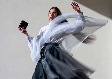 Fashionable Woman with Purse in Motion