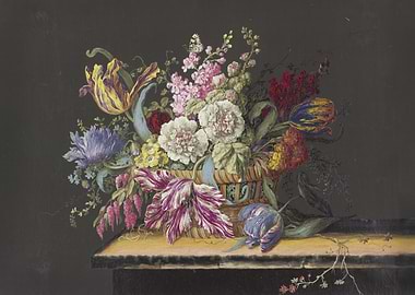 A flower basket with mallows, stocks, primroses, tulips and other flowers on a table