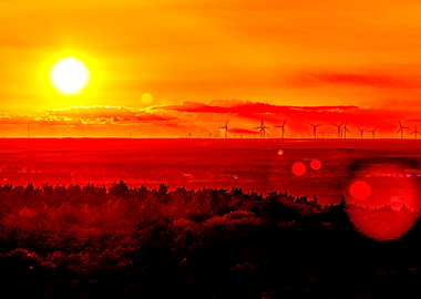 Fiery Sunset Over Wind Turbines