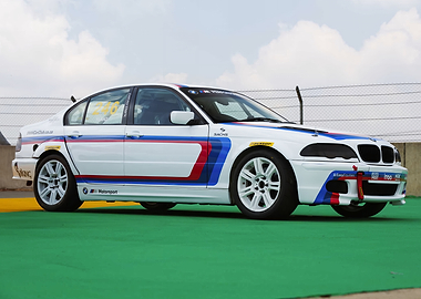 White BMW Race Car on Track