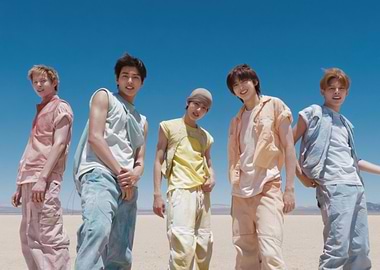 Five young men in desert landscape