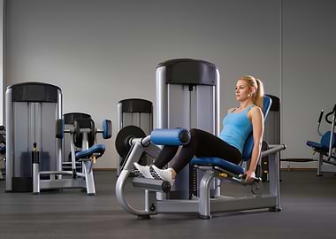 Woman using leg extension machine