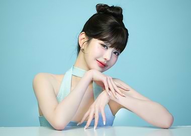 IVE Woman with Bun Hairstyle on Blue