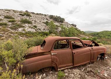 Abandoned Rusty Car in Nature