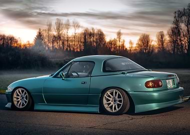 Teal Mazda Miata at Sunset