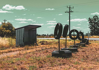 Rural Bus Stop with Tire Obstacles