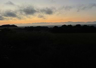Sunset over a dark landscape