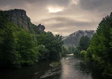 River flowing through a green landscape