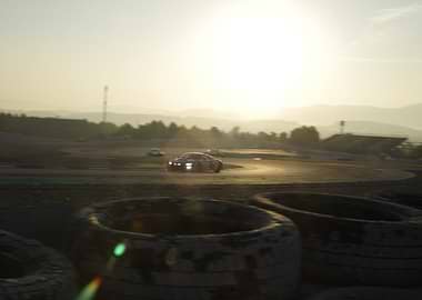 Race car on track at sunset