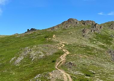 Mountain Trail Under Blue Alaskan Sky