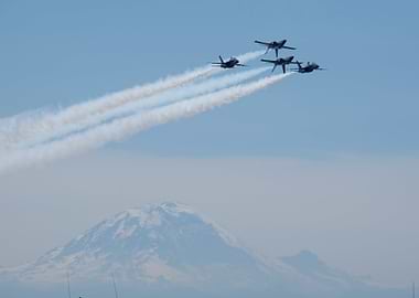 Blue Angels formation over mountain