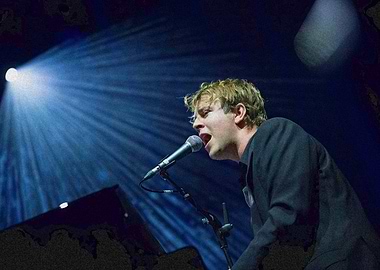 Singer performing on stage with microphone