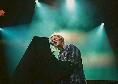 Singer at Piano on Stage