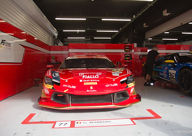 Red Ferrari Race Car in Garage