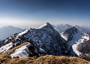 Snowy Mountain Peaks Under Clear Sky
