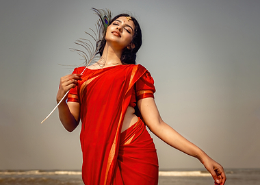 mamitha baiju in Red Saree with Peacock Feather
