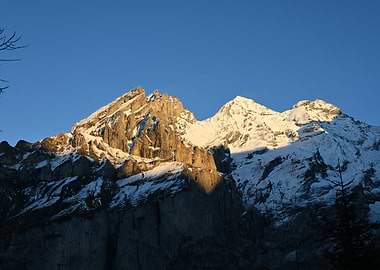 Snowy Mountain Peaks at Oeschinen Lake