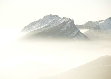 Snowy Mountain Peaks in Fog