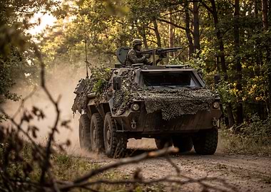 Camouflaged Military Vehicle in Forest