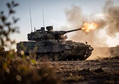 Tank firing on a battlefield