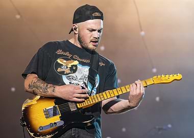 Man playing electric guitar on stage