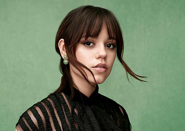 Jenna Ortega portrait on green background