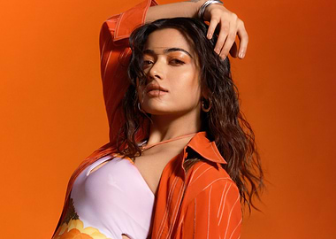 rashmika mandanna of a woman on orange background