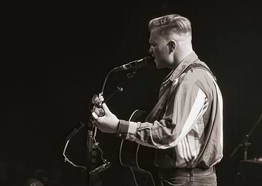 Musician performing with guitar and microphone