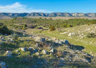 Photography of Rocky Landscape with Distant Mountains in Provence in France