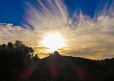 Photography Sunset over a Hilltop Castle in the Alpilles in Provence in France
