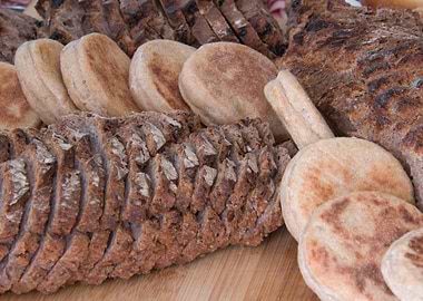 Assorted Breads on Wooden Surface