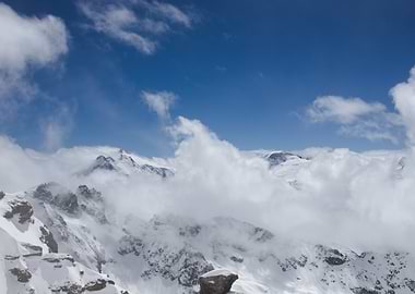 Snowy Mountains and Clouds