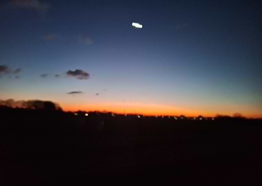 Sunset over a dark landscape