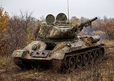 Camouflaged Tank in Muddy Terrain