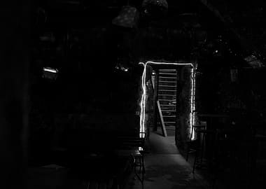 Dimly Lit Interior with Staircase