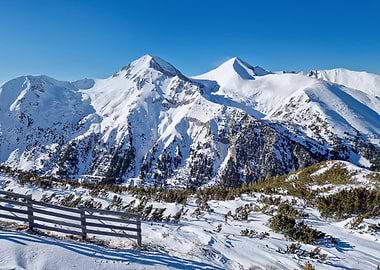 Snowy Mountain Peaks Under Clear Blue Sky