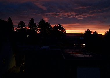 Dramatic Sunset Over Dark Silhouettes