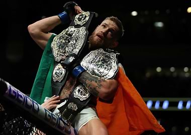 Conor McGregor with UFC Championship Belts