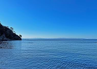 Blue Sea and Rocky Coastline