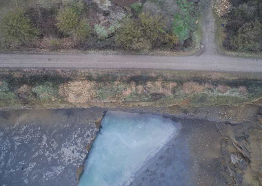 Aerial view of a road and lake