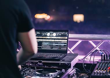 DJ setup with laptop and mixer