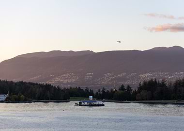 Vancouver harbor with mountains and plane