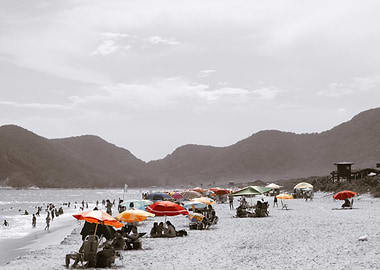 Beach scene black and white with colorful umbrellas