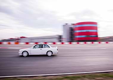 White BMW E30 on Race Track